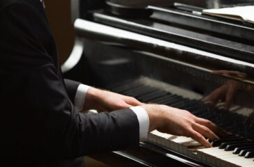 side-view-hands-playing-piano